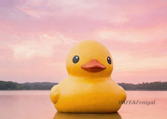 Vịt vàng hoạt hình bơm hơi thiết kế riêng phù hợp cho công viên ngoài trời và có thể sử dụng trên mặt nước